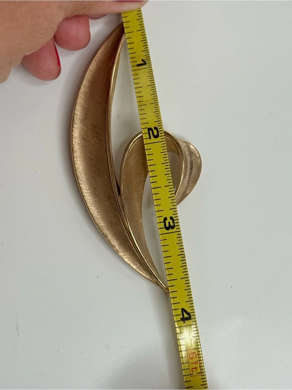 vintage Crown Trifari gold tone split leaf brooch from the 1960s.